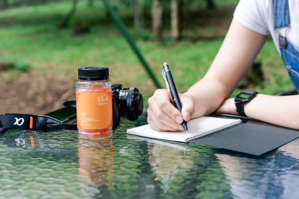 writing in nature with CBD gummies